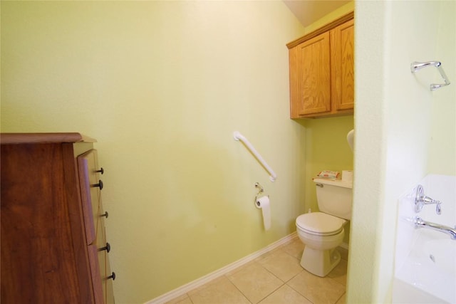 1800 Quiet Meadows Cv, Pflugerville, TX 78660 - bathroom with toilet, a tub to relax in, tile patterned floors, and baseboards
