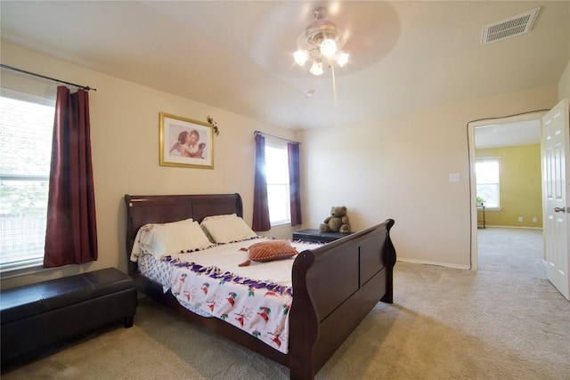 1800 Quiet Meadows Cv, Pflugerville, TX 78660 - carpeted bedroom featuring multiple windows, baseboards, and ceiling fan