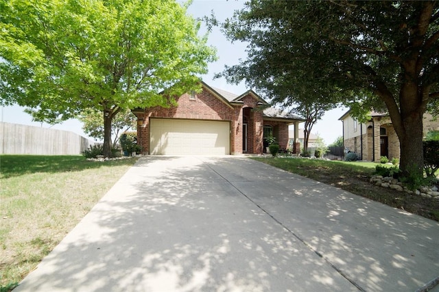 1800 Quiet Meadows Cv, Pflugerville, TX 78660 - view of front of home featuring brick siding, an attached garage, and driveway