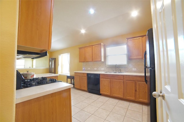 1800 Quiet Meadows Cv, Pflugerville, TX 78660 - kitchen featuring black appliances, decorative backsplash, light countertops, plenty of natural light, and recessed lighting