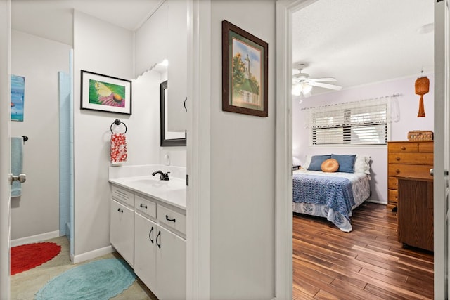 112 Skipcha Trl, Lampasas, TX 76550 - ensuite bathroom with vanity, ceiling fan, wood finished floors, and baseboards