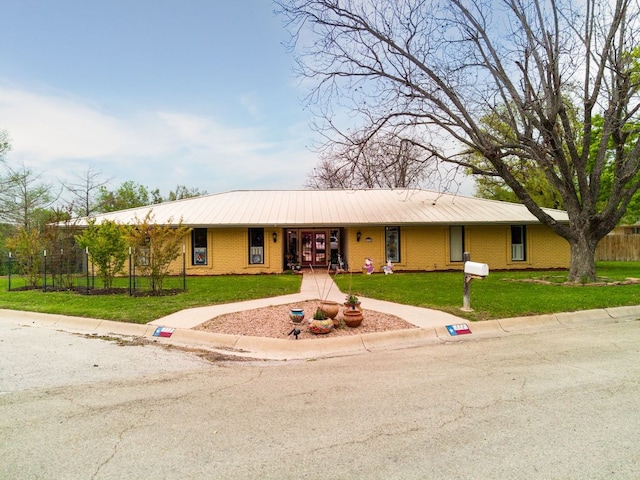 112 Skipcha Trl, Lampasas, TX 76550 - ranch-style house with brick siding, metal roof, and french doors