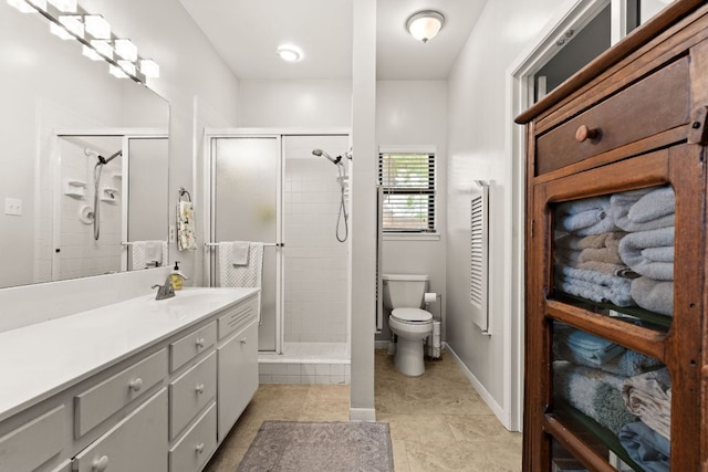 112 Skipcha Trl, Lampasas, TX 76550 - full bath featuring vanity, toilet, a shower stall, tile patterned flooring, and baseboards