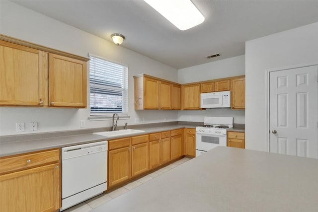 2225 Lou John St, Austin, TX 78727 - kitchen featuring white appliances, light tile patterned floors, and light countertops