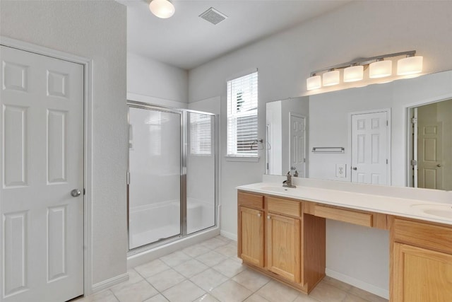 2225 Lou John St, Austin, TX 78727 - bathroom with a shower stall, double vanity, and tile patterned flooring