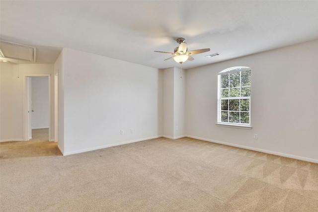 2225 Lou John St, Austin, TX 78727 - spare room featuring attic access, carpet flooring, a ceiling fan, and baseboards