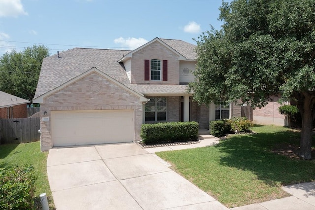 2225 Lou John St, Austin, TX 78727 - view of front facade featuring a shingled roof, brick siding, a garage, and driveway