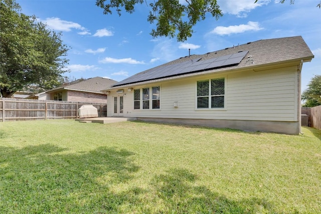 2225 Lou John St, Austin, TX 78727 - back of house with roof mounted solar panels and a patio area