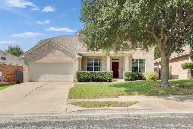 2225 Lou John St, Austin, TX 78727 - view of front facade with a garage, brick siding, concrete driveway, and a front yard