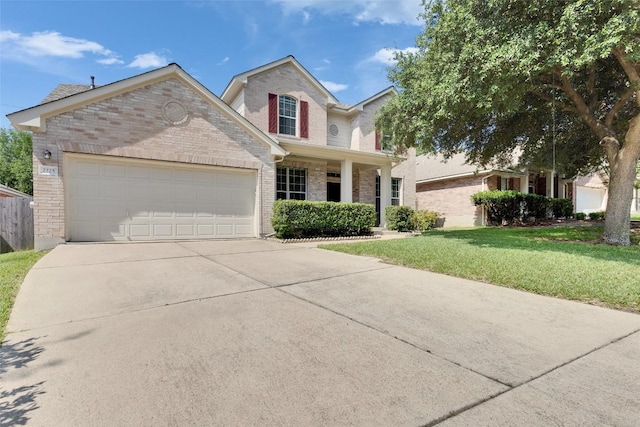 2225 Lou John St, Austin, TX 78727 - traditional-style home featuring brick siding, driveway, a front yard, and an attached garage