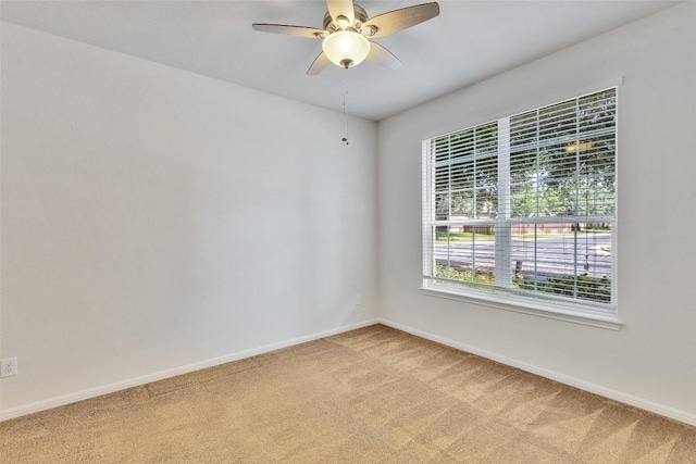 2225 Lou John St, Austin, TX 78727 - unfurnished room featuring light colored carpet, baseboards, and a ceiling fan