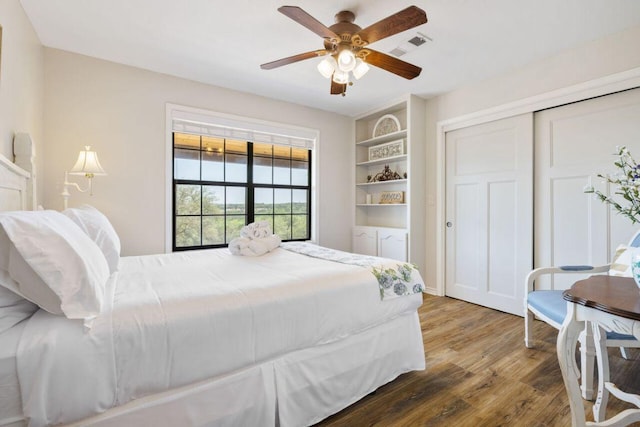 25404 Hamilton Pool Rd, Round Mountain, TX 78663 - bedroom featuring wood finished floors, a closet, and a ceiling fan