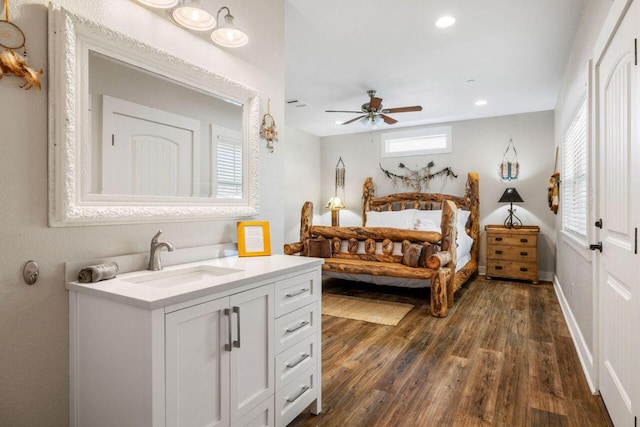 25404 Hamilton Pool Rd, Round Mountain, TX 78663 - bedroom with a sink, dark wood finished floors, recessed lighting, and a ceiling fan