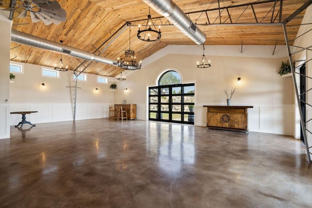 25404 Hamilton Pool Rd, Round Mountain, TX 78663 - garage with wooden ceiling and a wainscoted wall