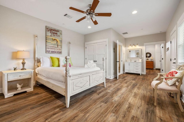 25404 Hamilton Pool Rd, Round Mountain, TX 78663 - bedroom with wood finished floors, recessed lighting, connected bathroom, a ceiling fan, and baseboards