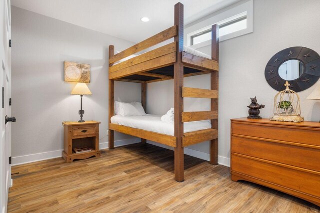 25404 Hamilton Pool Rd, Round Mountain, TX 78663 - bedroom featuring baseboards, light wood finished floors, and recessed lighting