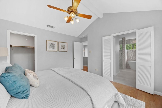 8316 Greenslope Dr Unit A, Austin, TX 78759 - bedroom with wood finished floors, a closet, baseboards, a ceiling fan, and a spacious closet