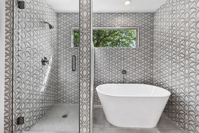 8316 Greenslope Dr Unit A, Austin, TX 78759 - full bath featuring a freestanding bath, a shower stall, and tile patterned floors