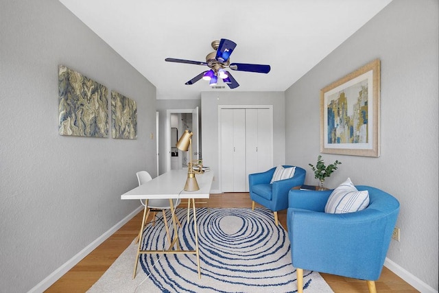 8316 Greenslope Dr Unit A, Austin, TX 78759 - home office with baseboards, a ceiling fan, and wood finished floors