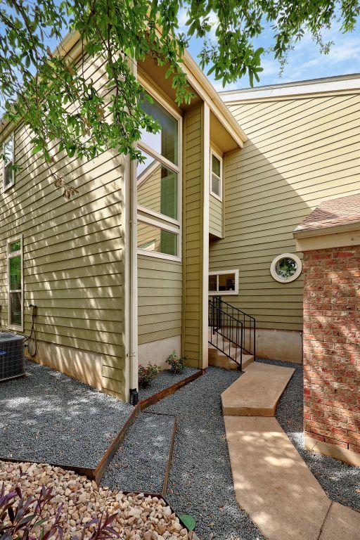 8316 Greenslope Dr Unit A, Austin, TX 78759 - view of exterior entry featuring central AC