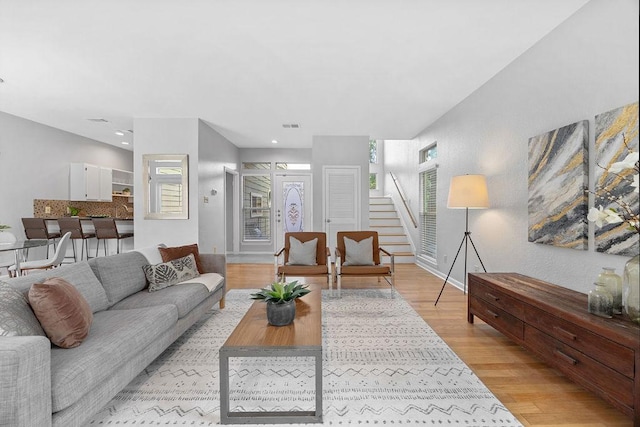 8316 Greenslope Dr Unit A, Austin, TX 78759 - living room with light wood-style floors, stairs, recessed lighting, and baseboards