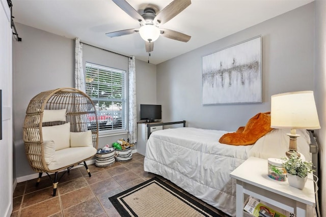 1003 Buttercup Ct, Leander, TX 78641 - bedroom featuring baseboards, stone finish floors, and a ceiling fan