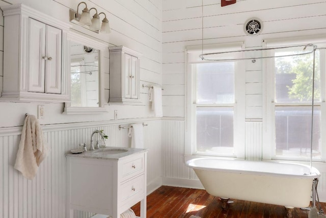1211 E 13th St, Austin, TX 78702 - full bath with a freestanding bath, hardwood / wood-style flooring, and vanity