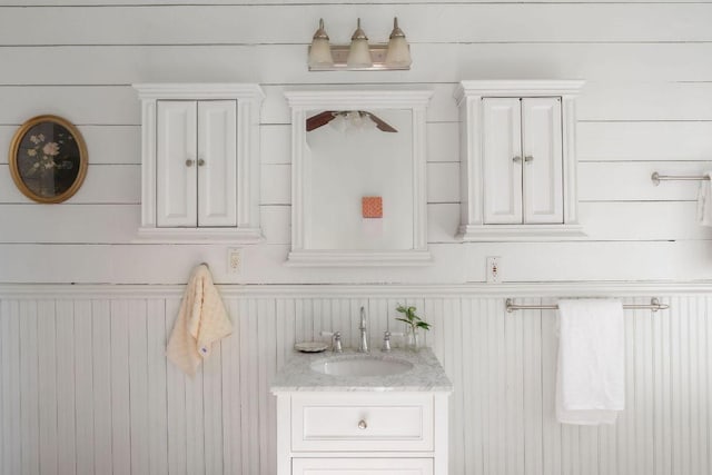 1211 E 13th St, Austin, TX 78702 - bathroom with vanity and wood walls