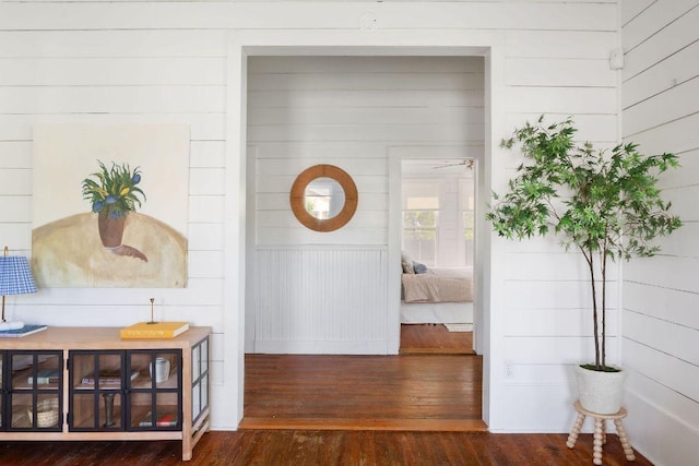 1211 E 13th St, Austin, TX 78702 - hallway featuring wood-type flooring and wooden walls