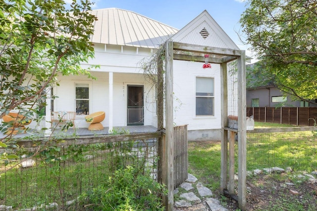 1211 E 13th St, Austin, TX 78702 - view of front of house with a porch, metal roof, and a standing seam roof