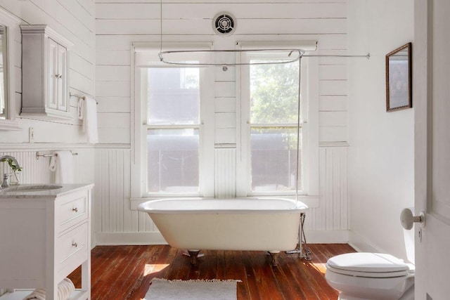 1211 E 13th St, Austin, TX 78702 - full bath with a freestanding bath, hardwood / wood-style floors, vanity, and toilet