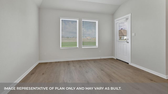 362 Barron Estate Dr, Lockhart, TX 78644 - unfurnished room with wood finished floors, lofted ceiling, and baseboards