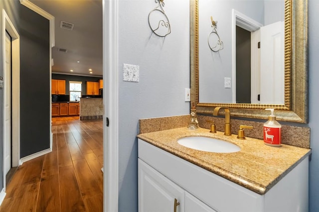 1454 Rose Ln, Canyon Lake, TX 78133 - bathroom featuring wood finished floors and vanity