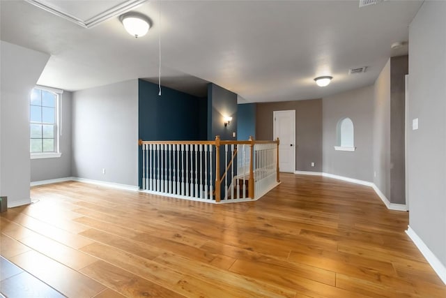 1454 Rose Ln, Canyon Lake, TX 78133 - unfurnished room featuring attic access, light wood-style floors, and baseboards