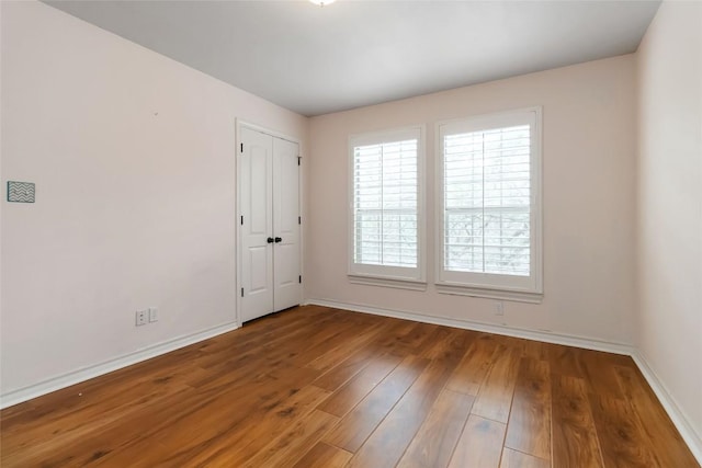 1454 Rose Ln, Canyon Lake, TX 78133 - spare room with baseboards and wood finished floors