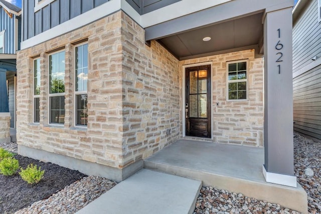 1621 Coral Sunrise Aly, Leander, TX 78641 - property entrance featuring stone siding and a porch