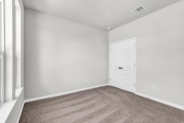 1621 Coral Sunrise Aly, Leander, TX 78641 - spare room with carpet and baseboards