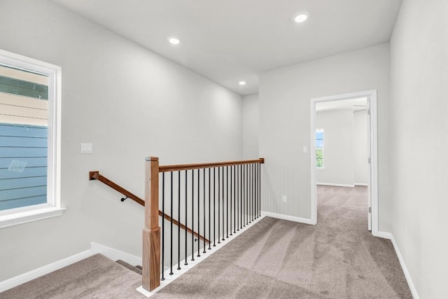 1621 Coral Sunrise Aly, Leander, TX 78641 - hallway with an upstairs landing, carpet flooring, recessed lighting, and baseboards