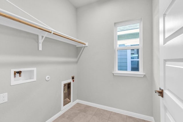 1621 Coral Sunrise Aly, Leander, TX 78641 - washroom with washer hookup, electric dryer hookup, baseboards, light tile patterned floors, and gas dryer hookup