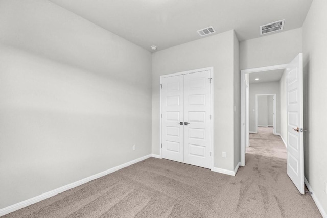 1621 Coral Sunrise Aly, Leander, TX 78641 - unfurnished bedroom with carpet flooring, a closet, and baseboards