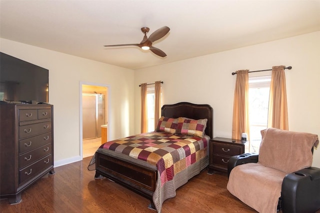1367 Indian Pass, Salado, TX 76571 - bedroom with dark wood finished floors, ceiling fan, ensuite bathroom, and baseboards