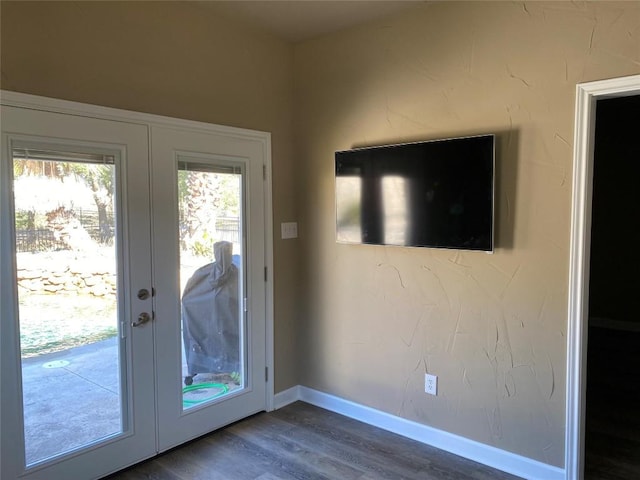 1367 Indian Pass, Salado, TX 76571 - doorway featuring french doors, dark wood finished floors, and baseboards