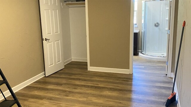 1367 Indian Pass, Salado, TX 76571 - unfurnished bedroom with dark wood finished floors, baseboards, and a closet