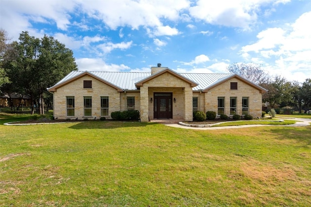 1367 Indian Pass, Salado, TX 76571 - view of front of home featuring stone siding, a chimney, a front yard, a standing seam roof, and metal roof