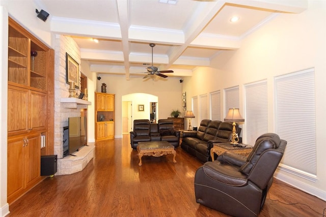1367 Indian Pass, Salado, TX 76571 - living area featuring beam ceiling, arched walkways, a fireplace, coffered ceiling, and dark wood-style floors
