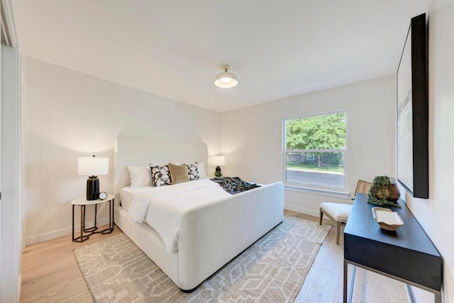 1314 Ridgemont Dr, Austin, TX 78723 - bedroom with light wood-type flooring and baseboards