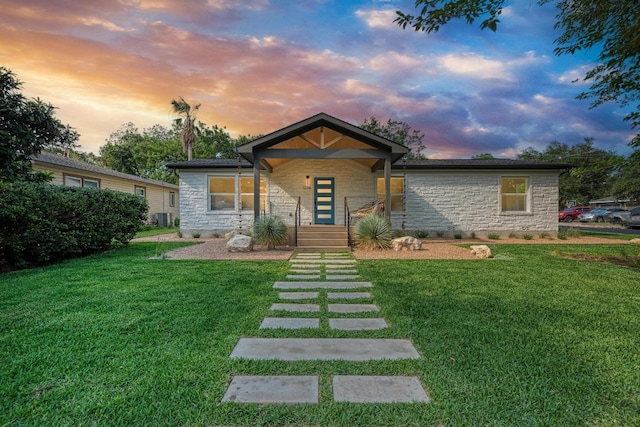 1314 Ridgemont Dr, Austin, TX 78723 - view of front of home featuring stone siding and a front yard