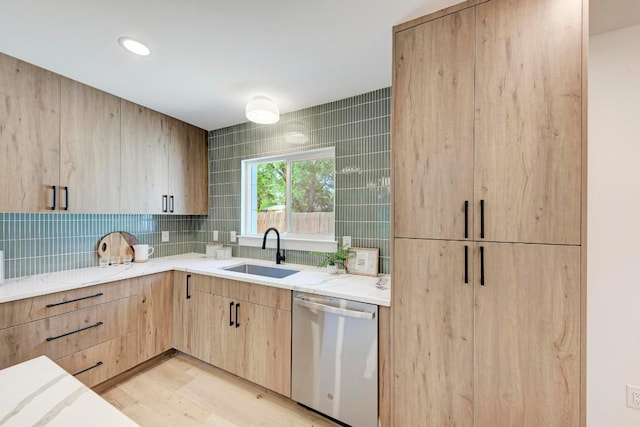 1314 Ridgemont Dr, Austin, TX 78723 - kitchen featuring dishwasher, a sink, light brown cabinetry, light stone countertops, and recessed lighting