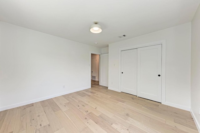 1314 Ridgemont Dr, Austin, TX 78723 - unfurnished bedroom featuring light wood-style flooring and a closet