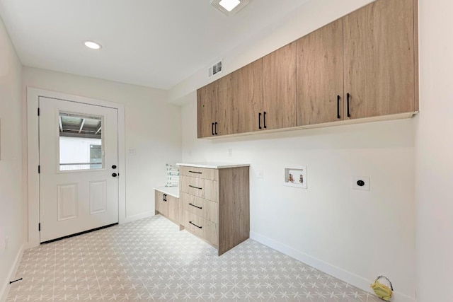 1314 Ridgemont Dr, Austin, TX 78723 - washroom with electric dryer hookup, cabinet space, baseboards, hookup for a washing machine, and light floors
